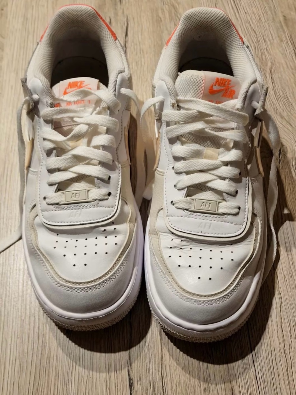 Nike Kids White Sneakers with Orange Accents